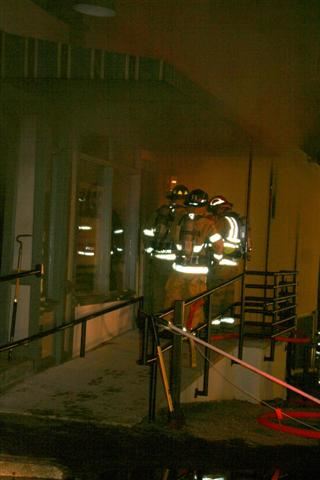 Other firefighters rush in